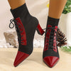 Chic black and red pointed toe lace-up booties with block heel for stylish comfort in all seasons and occasions.
