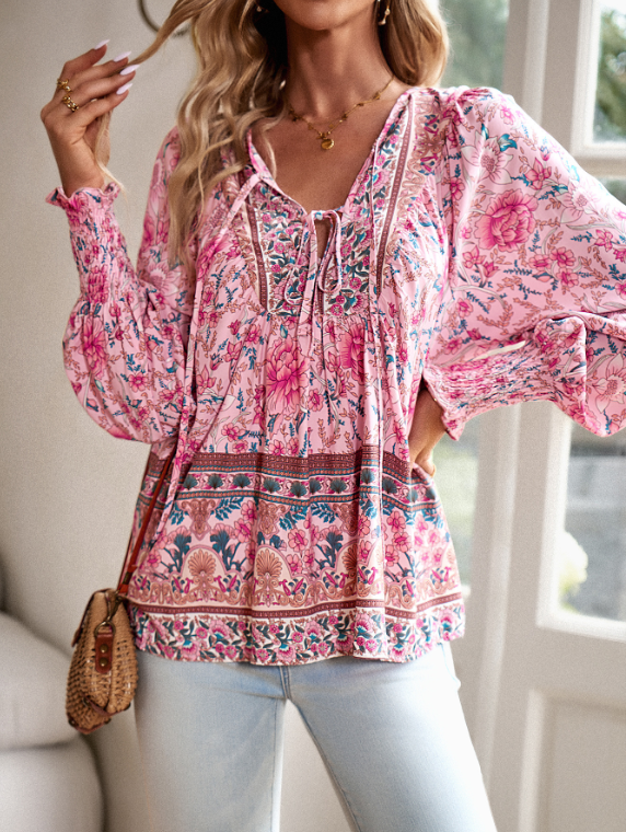 Bohemian lace-up V-neck blouse for women with vibrant print, lantern sleeves, and loose fit, perfect for spring and summer.