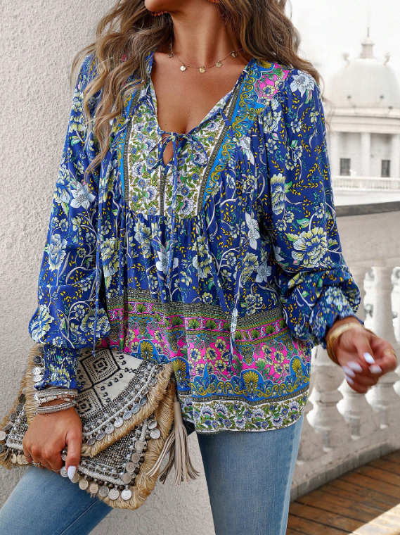 Bohemian lace-up V-neck blouse for women with vibrant print, lantern sleeves, and loose fit, perfect for spring and summer.