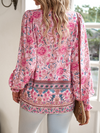 Bohemian lace-up V-neck blouse for women in vibrant print, featuring lantern sleeves and a loose fit, perfect for spring and