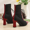Chic black and red pointed toe lace-up booties with block heel for stylish comfort in all seasons and occasions.
