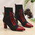 Chic black and red pointed toe lace-up booties with block heel for stylish comfort in all seasons and occasions.