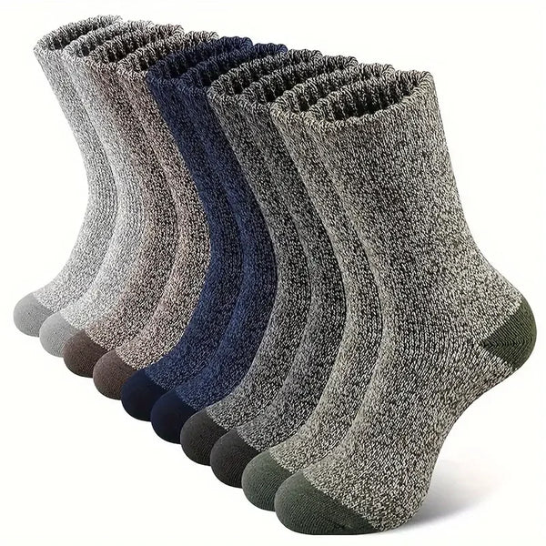 Pair of navy Merino wool socks designed for warmth and comfort in winter.