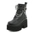 Statement platform boots featuring metal chain decoration and edgy black design