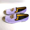 Elegant men's footwear in rich velvet with gold accents.