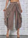Chic summer harem pants with tassel detail, lightweight, relaxed fit, ankle-length, perfect for casual outings and beach wear