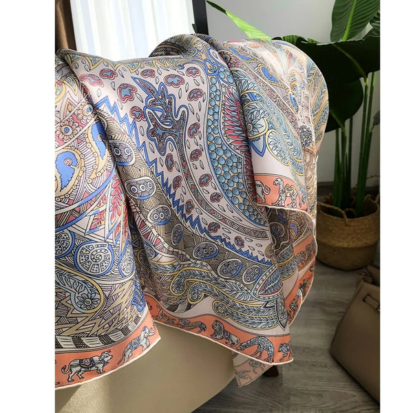 Silk twill scarf draped elegantly over a summer dress.