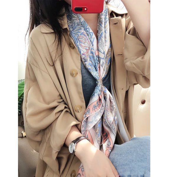 Detail of the classic paisley pattern on the premium silk scarf.