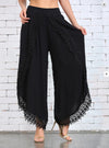 Chic summer harem pants with tassel detail, lightweight, relaxed fit, ankle-length, perfect for casual outings and beach wear