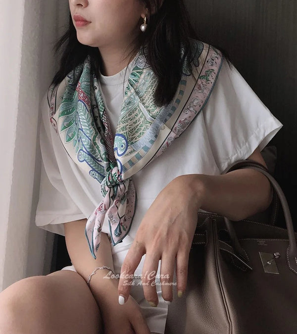 Elegant paisley shawl laid out to show its generous size.