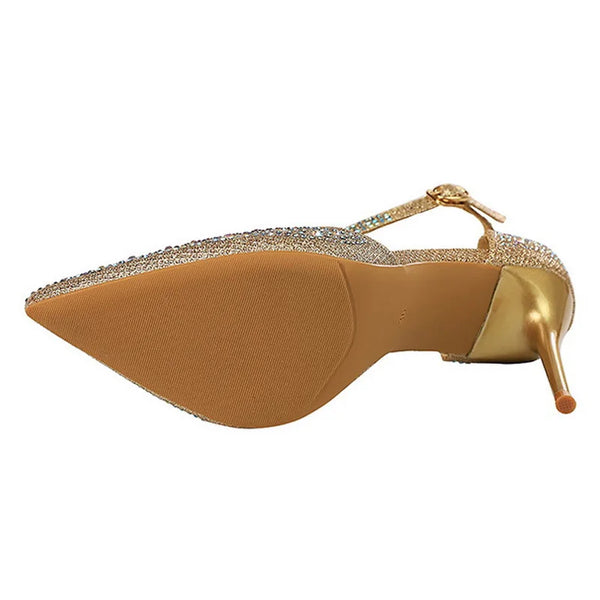 Detail shot of adjustable buckle strap on rhinestone embellished stiletto pumps
