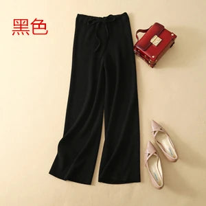Luxe cashmere blend wide-leg pants for women, featuring a high waist, soft fabric, and comfortable elastic waistband.