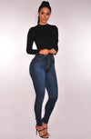 High-waist stretch skinny jeans for women in light vintage wash, featuring a button fly and slim fit for stylish comfort.