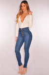 High-waist stretch skinny jeans for women in light vintage wash, featuring a button fly and slim fit for stylish comfort.