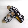 Men's party footwear featuring plush lining and gold accents.