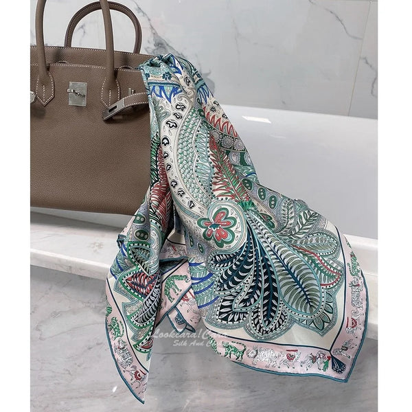 Silk twill scarf wrapped around the shoulders for warmth.