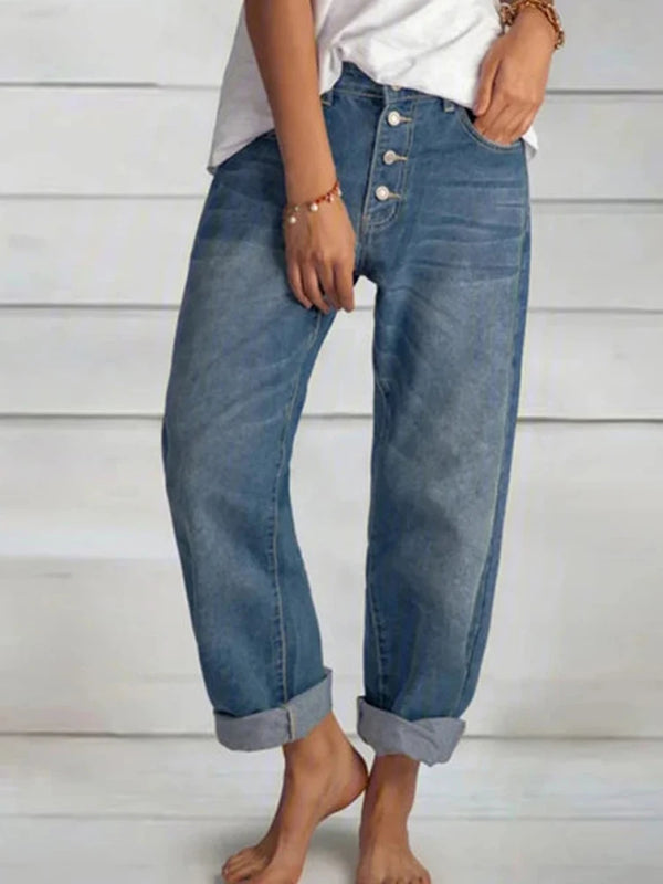Light wash high-waisted boyfriend jeans with wide leg cut and authentic button fly