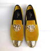 Fashionable slip-on loafers for men in rich velvet with gold accents.