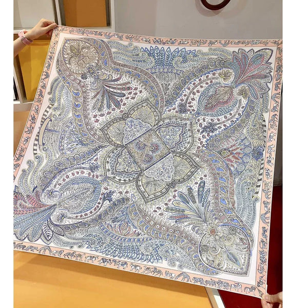 Flat lay of the 35-inch square paisley shawl showcasing its rich colors.