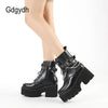 Black ankle boots featuring metal chain decoration and super high platform heel
