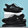 Slip-on breathable sandals featuring handwoven construction and flat heel