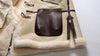 Luxury men's shearling leather bomber jacket with a winter scarf.
