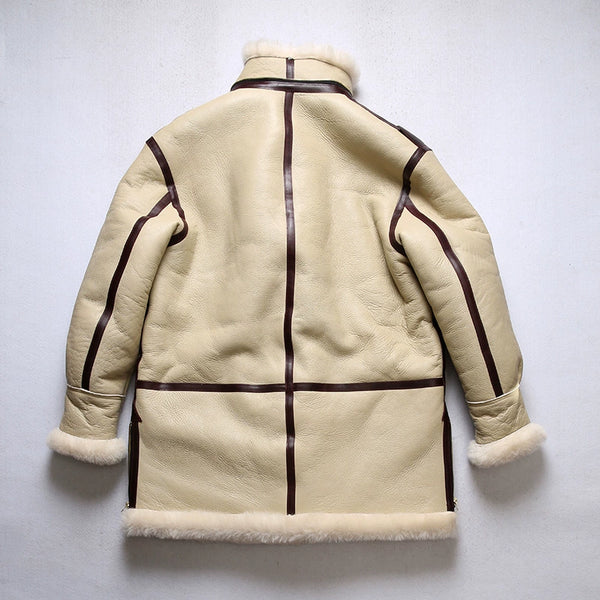 Model styling the luxury men's shearling leather bomber jacket with jeans.