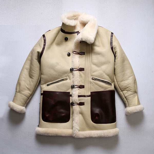Luxury men's shearling leather bomber jacket with zippered pockets open.
