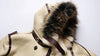 Luxury men's shearling leather bomber jacket in a winter setting.