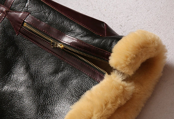 Model demonstrating the warmth of the luxury men's shearling leather bomber jacket.
