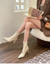 Chic black ankle boots with slim high heels, pointed toe design, perfect for autumn and winter fashion. Stylish women's footw
