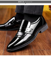 Side view of black leather Oxford shoes with classic design.