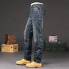 Men's vintage wash straight jeans paired with a stylish shirt.