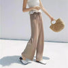 Chic wide leg summer pants for women in ice silk, pleated design, perfect for casual outings and warm weather comfort.