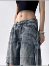 Trendy high-waist wide-leg ripped jeans for women with tie-dye and distressed detailing, perfect for casual street style.
