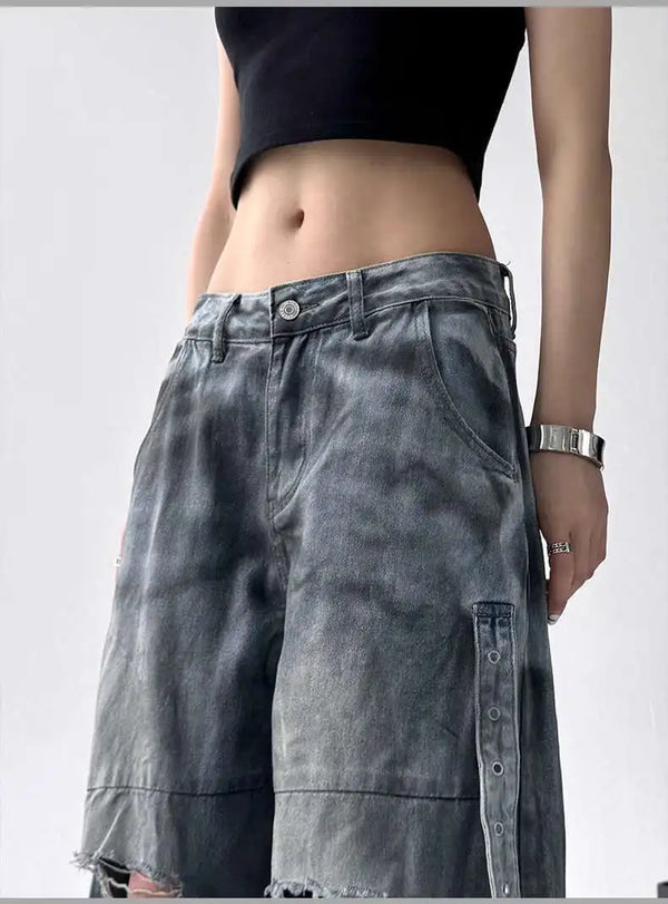 Trendy high-waist wide-leg ripped jeans for women with tie-dye and distressed detailing, perfect for casual street style.