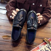 Elegant black tassel loafers showcasing traditional craftsmanship.