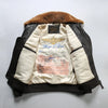 Close-up of the genuine cowhide leather texture on the Top Gun bomber jacket.
