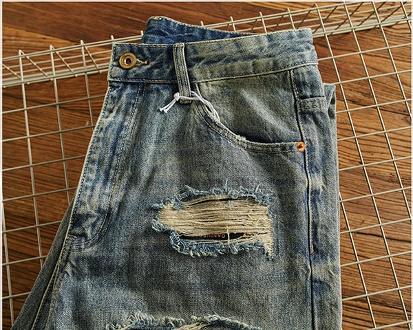 Rebel Spirit Distressed Jeans displayed with a casual jacket, ideal for timeless style.