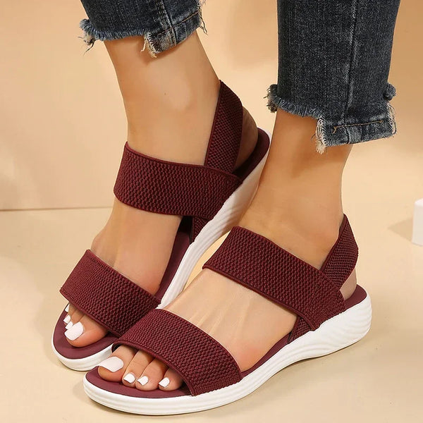Breathable knit wedge sandals with secure back strap and flattering low heel height