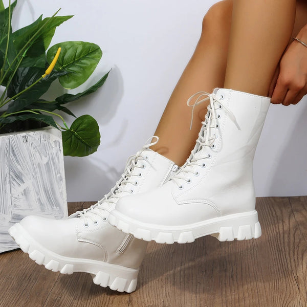 Chic white ankle boots with chunky heel, lace-up closure, and durable PU leather for stylish fall/winter outfits.