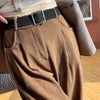 Women wearing beige corduroy wide leg pants with high waist design and flowing silhouette