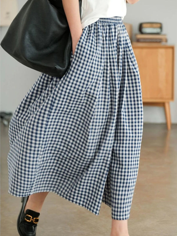 Chic plaid wide-leg pants in cotton-linen blend, featuring a high waist, pockets, and elastic waistband for comfort and style
