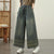Vintage embroidered wide-leg jeans for women, featuring elastic waist and ethnic-inspired design, perfect for autumn fashion.