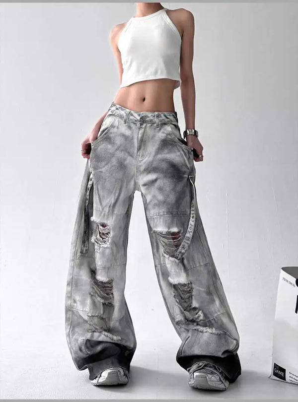Trendy high-waist wide-leg ripped jeans for women with tie-dye and distressed detailing, perfect for casual street style.