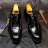 Elegant carved Oxford shoes designed for boardroom-ready attire.