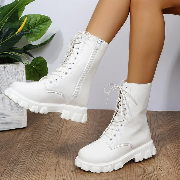 Chic white ankle boots with chunky heel, lace-up closure, and durable PU leather for stylish fall/winter outfits.