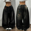 Blue wide-leg jeans with striking designs for urban fashion lovers.