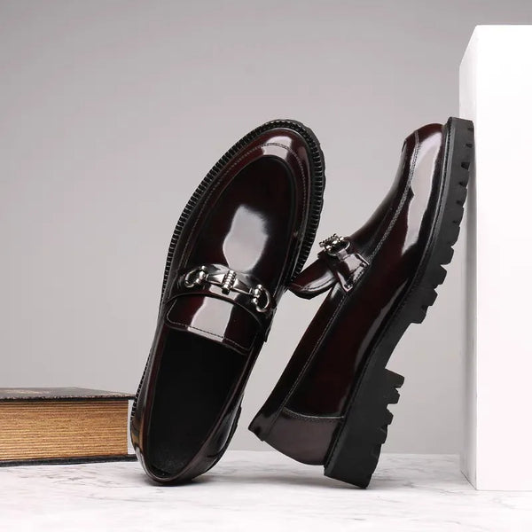 Close-up of the rubber outsole on black Oxfords for durability.