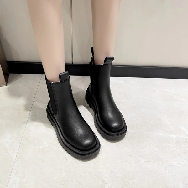 Chic Chelsea boots for women with thick sole, slip-on design, and durable rubber outsole, perfect for casual autumn wear.